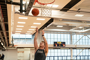 Student playing basketball