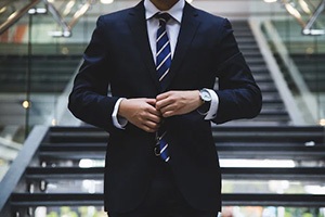 Person wearing a dark suit