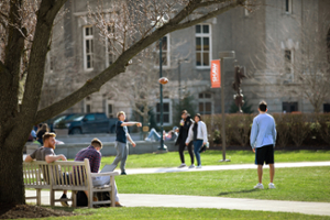 Students playing football on the quad